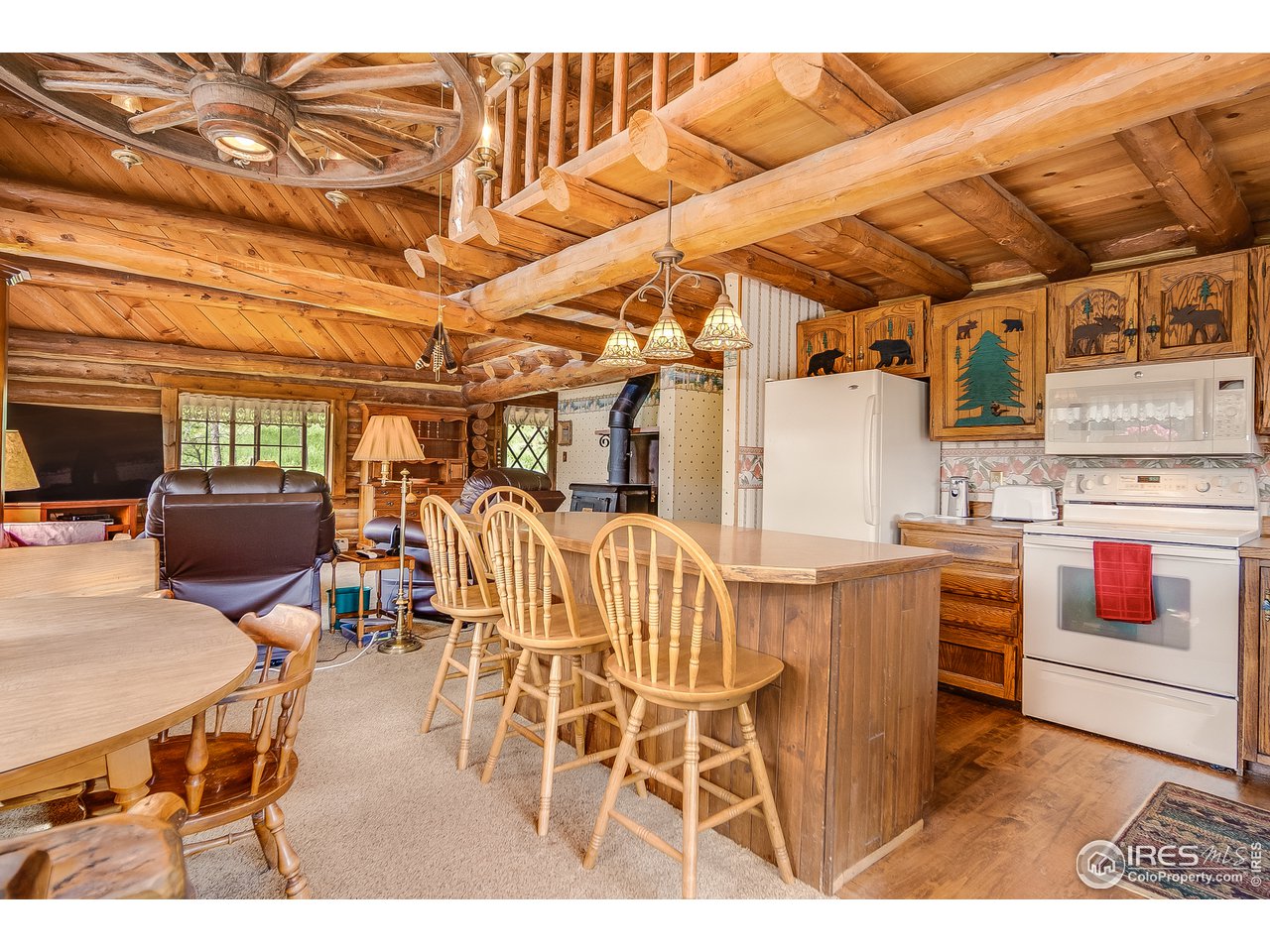 49 Moose Road Lyons, CO 80540 - Photo 21 of 40 a view of a dining room with furniture