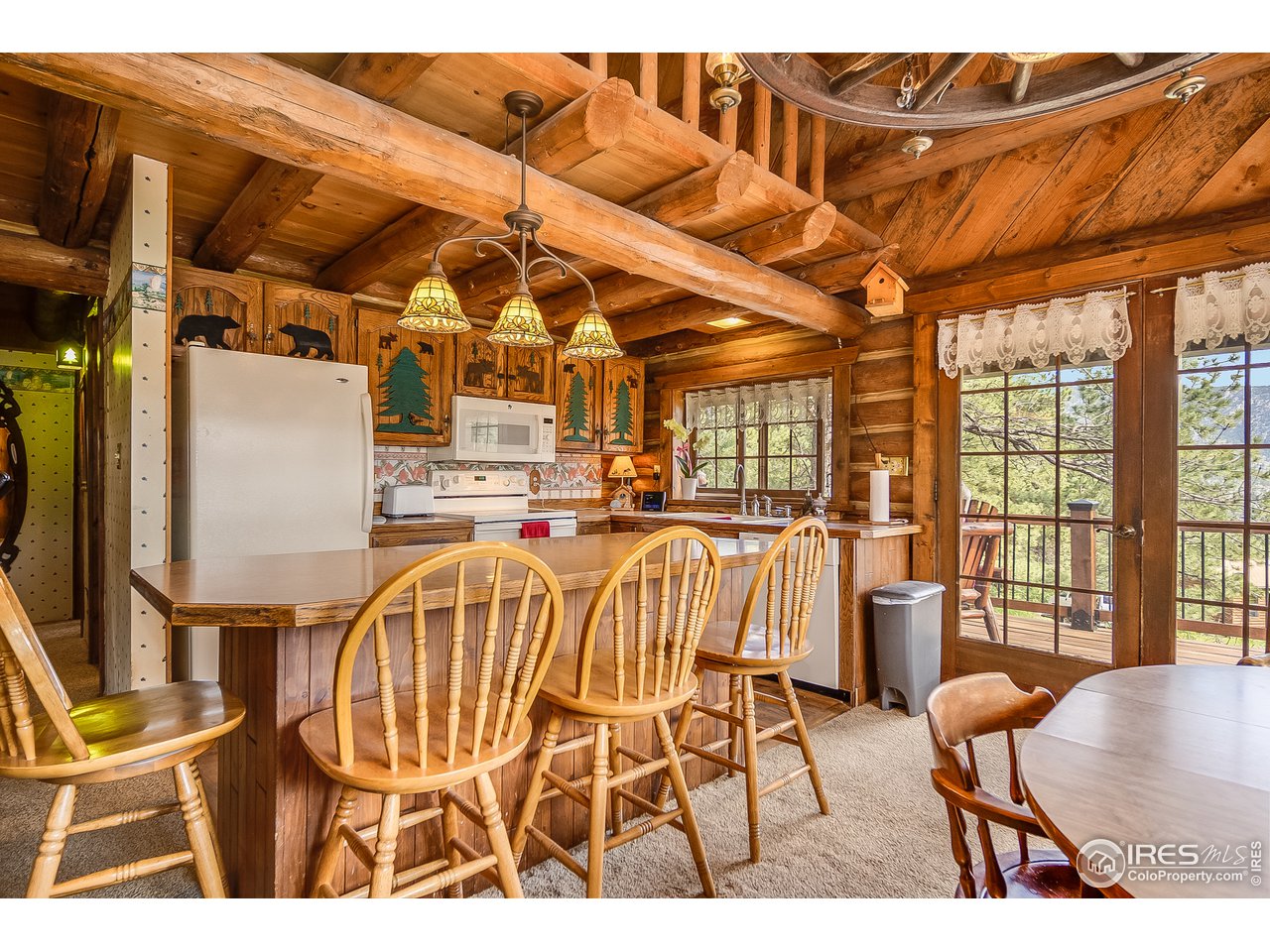 49 Moose Road Lyons, CO 80540 - Photo 22 of 40 a balcony with furniture and wooden floor