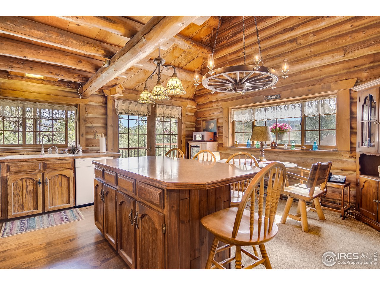 49 Moose Road Lyons, CO 80540 - Photo 5 of 40 a dining room with furniture and wooden floor