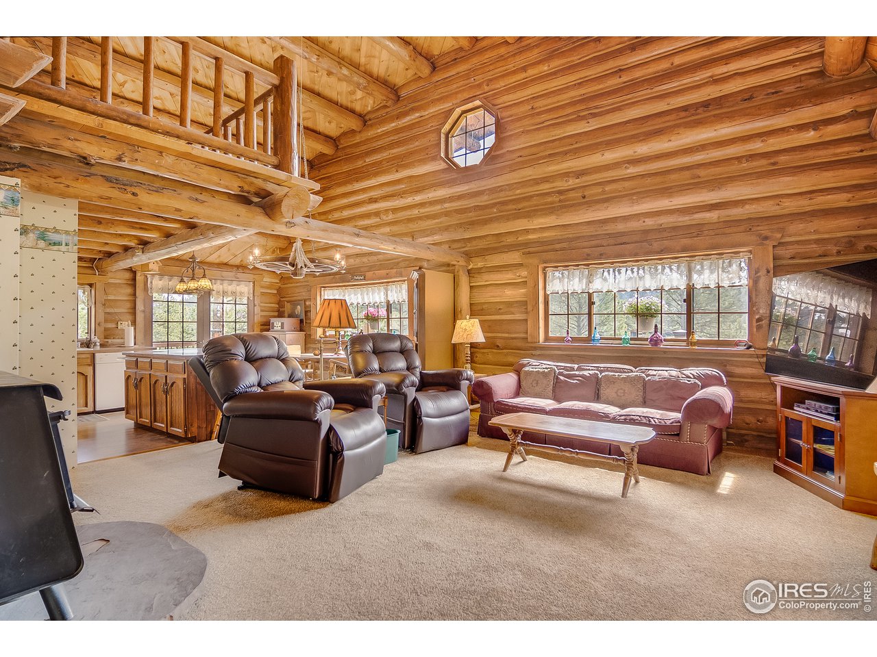 49 Moose Road Lyons, CO 80540 - Photo 7 of 40 a living room with furniture and a large window
