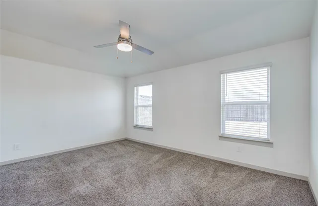 a bathroom with a granite countertop sink a mirror and a vanity