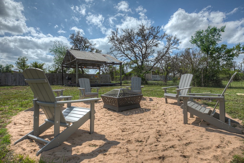 271 North Third Street Harper, TX 78631 - Photo 16 of 19 a view of a sitting area with furniture in backyard