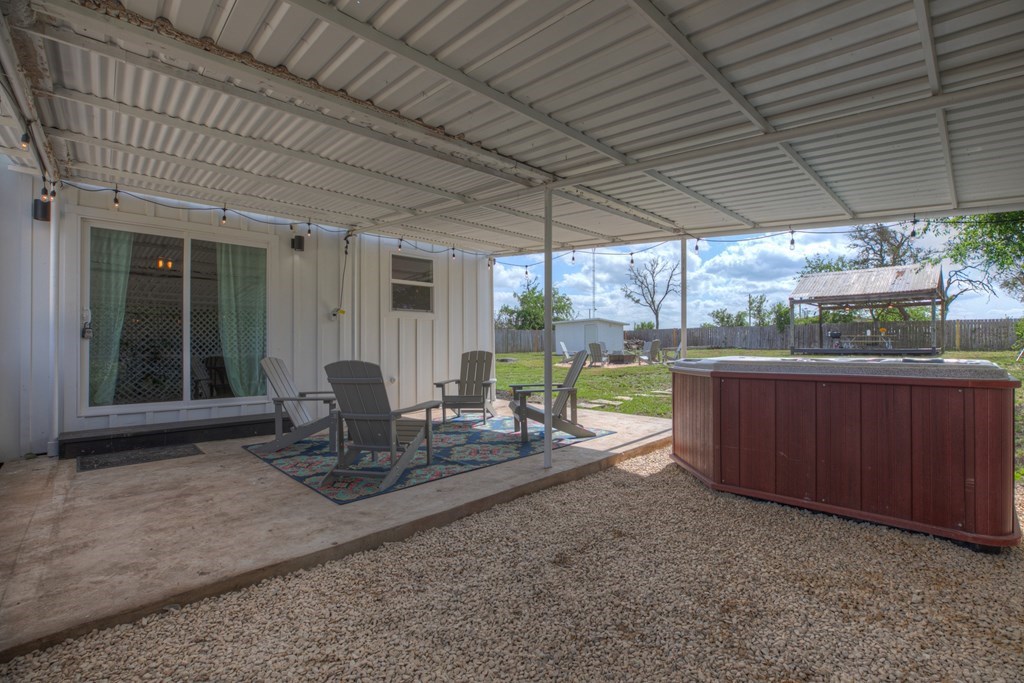 271 North Third Street Harper, TX 78631 - Photo 18 of 19 a dining room with wooden floor and outdoor seating