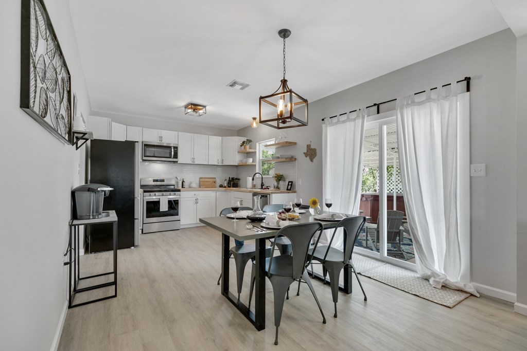 271 North Third Street Harper, TX 78631 - Photo 7 of 19 a view of a dining room with furniture window and wooden floor
