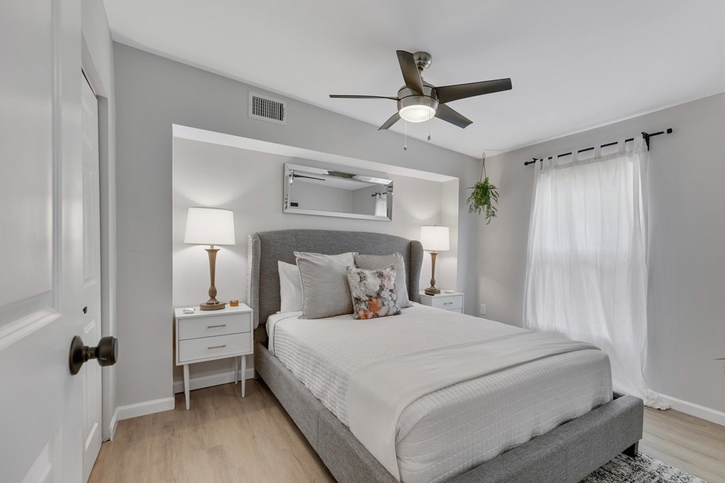 271 North Third Street Harper, TX 78631 - Photo 10 of 19 a bedroom with a bed and a ceiling fan