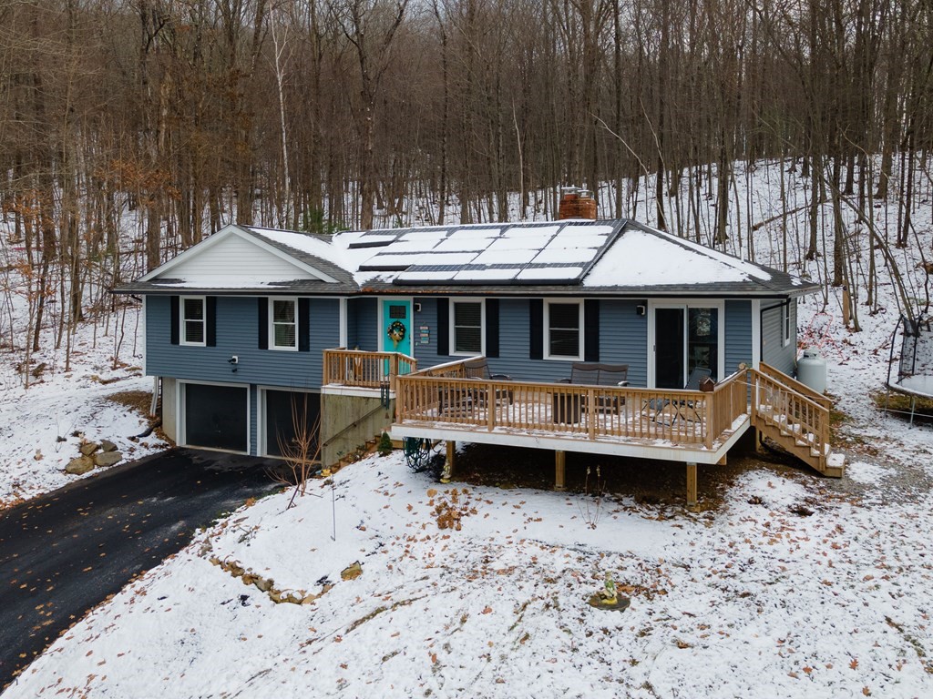16 Vinton Road Holland, MA 01521 - Photo 1 of 32 a front view of a house with a yard and sitting area