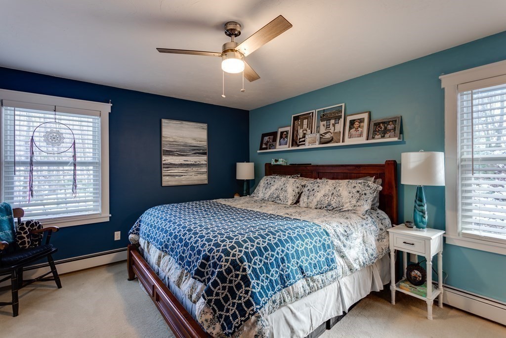 16 Vinton Road Holland, MA 01521 - Photo 23 of 32 a bedroom with a bed next to a window and a tv