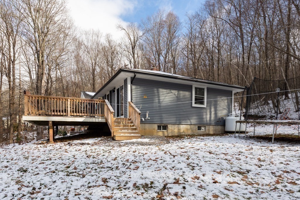 16 Vinton Road Holland, MA 01521 - Photo 28 of 32 a view of a house with a yard chairs and wooden fence