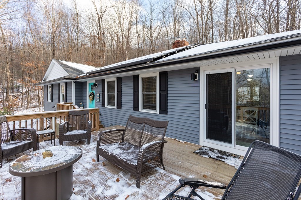 16 Vinton Road Holland, MA 01521 - Photo 3 of 32 a view of a patio with a table and chairs