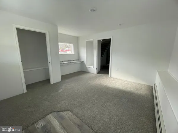 a view of an empty room and window