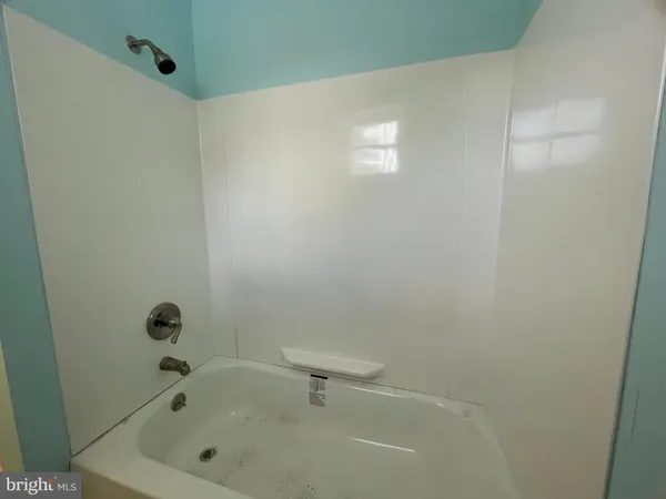 an empty room with a windows