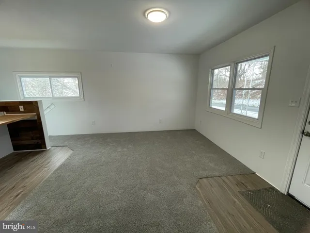 a kitchen with stainless steel appliances granite countertop a stove refrigerator sink and microwave