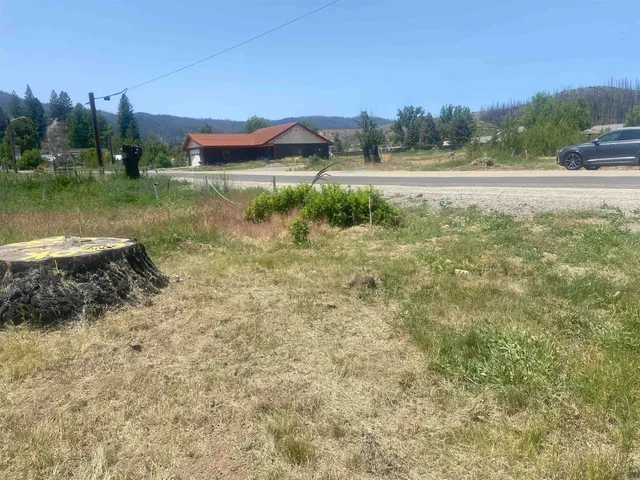 a view of a lake with a house in the background