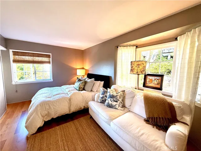 a bedroom with a bed and a couch