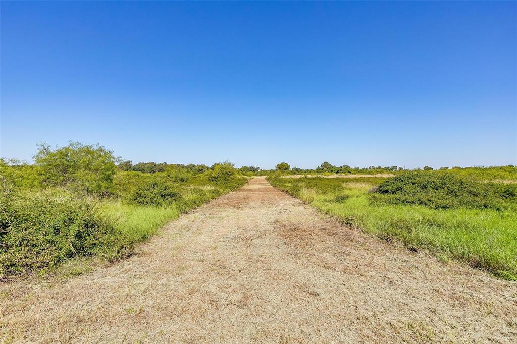 1242 County Road 1242 Cleburne, TX 76033 - Photo 19 of 19 a view of a lake with beach