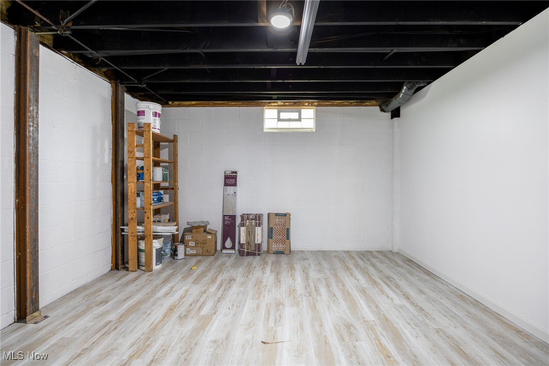 2840 Wadsworth Road Barberton, OH 44203 - Photo 22 of 32 Below grade area with light wood finished floors