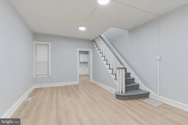a view of entryway with wooden floor