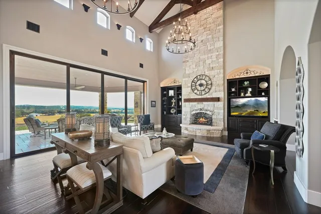 a kitchen with stainless steel appliances granite countertop a stove a sink dishwasher and a refrigerator with wooden floor