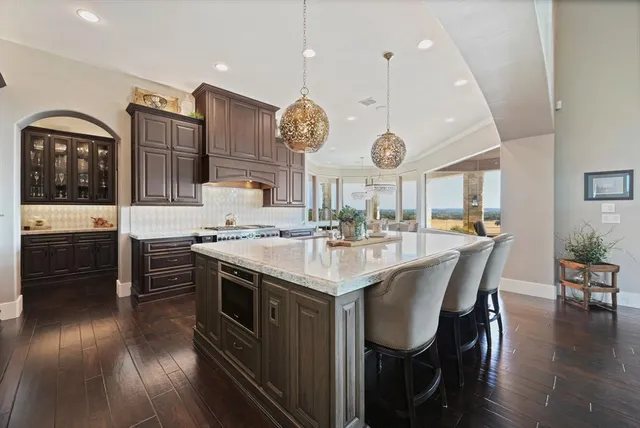 a kitchen with stainless steel appliances granite countertop lots of counter top space