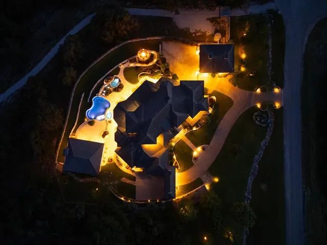 an aerial view of a house with a garden