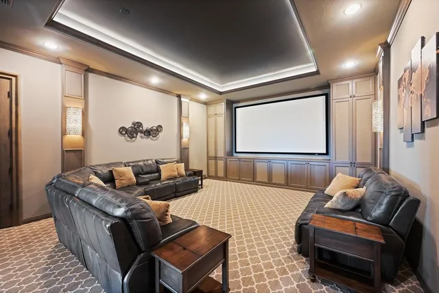 a spacious bedroom with a bed and large windows