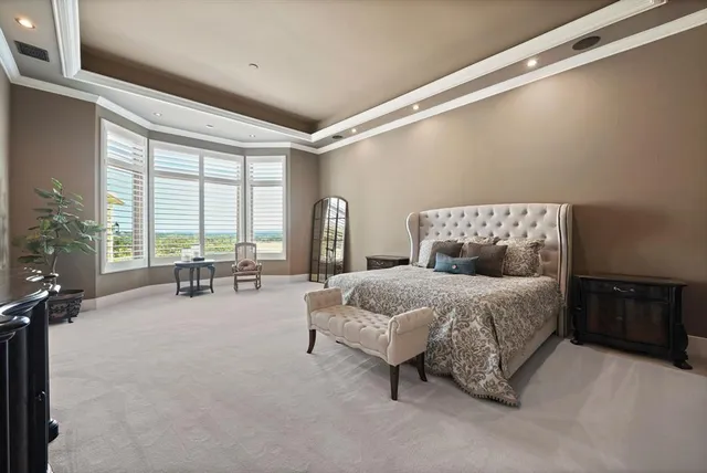 a bathroom with a bathtub and mirror