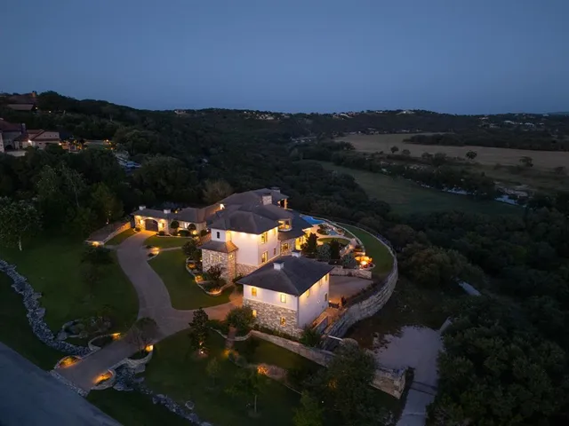 a view of a swimming pool with a patio