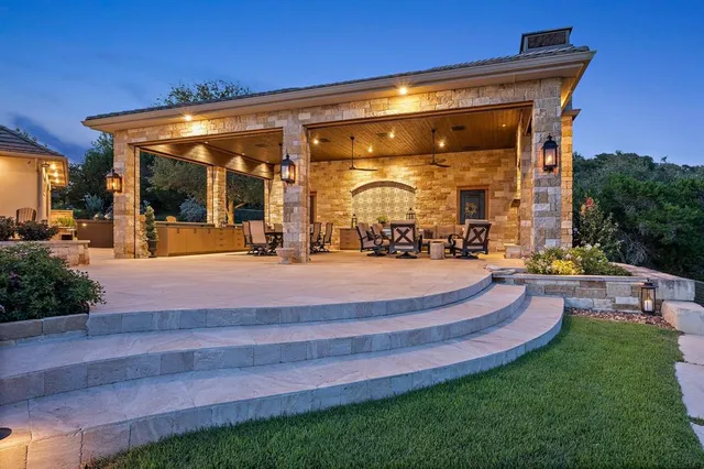 a view of a swimming pool with an outdoor seating