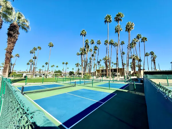 a view of a swimming pool with a yard