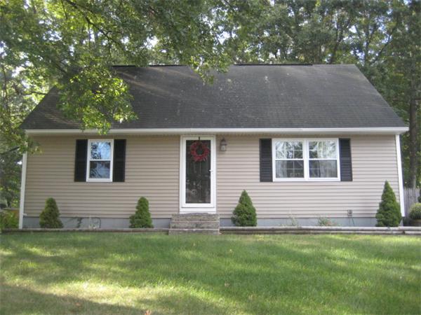 a view of house with backyard