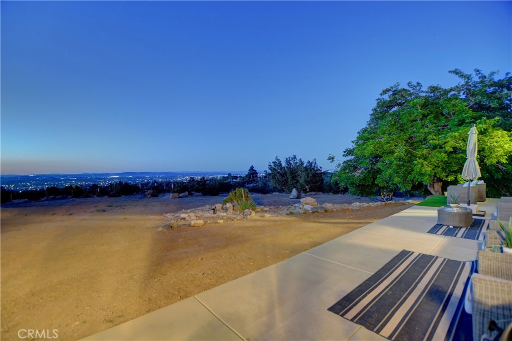 1330 Tamarack Road Pinon Hills, CA 92372 - Photo 12 of 19 a view of swimming pool with seating area and trees in the background