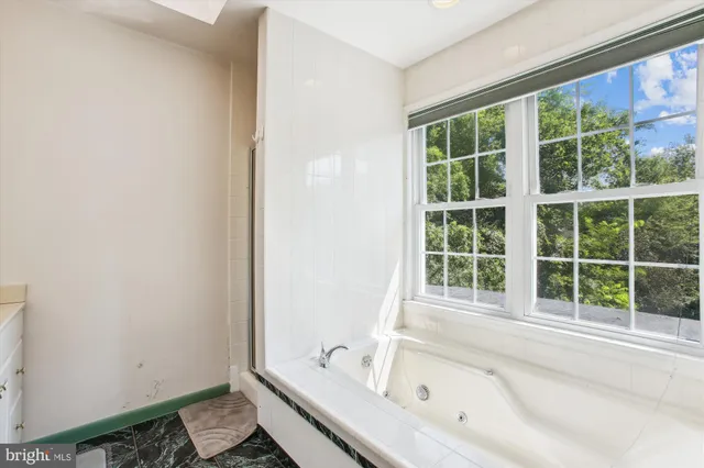 a bedroom with bed and window