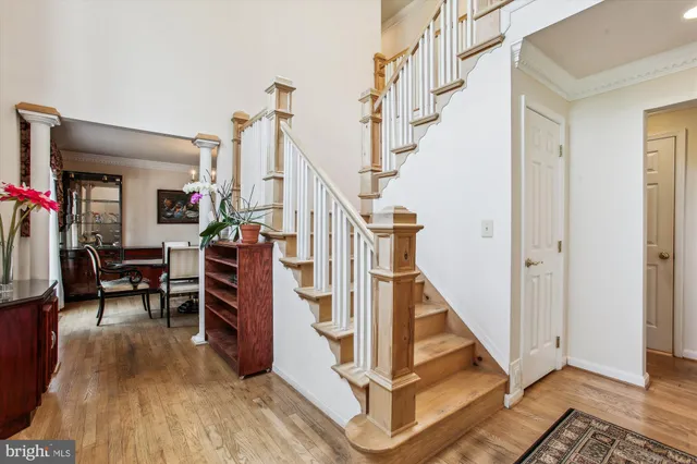 a view of entryway dining room and hall with wooden floor