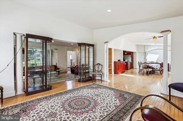 a living room with furniture rug and wooden floor