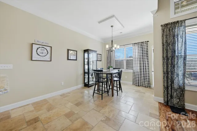 a view of a dining room with furniture and window