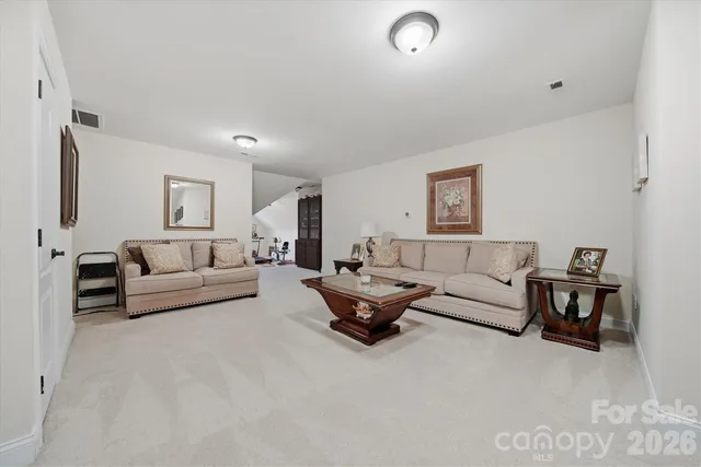 a living room with furniture and a couch