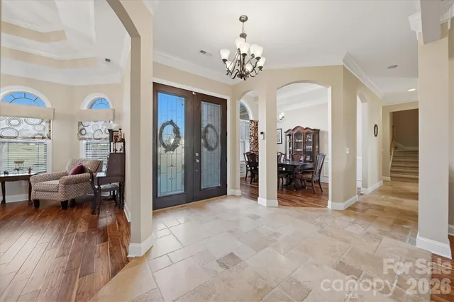 a view of a livingroom kitchen and dining room with wooden floor