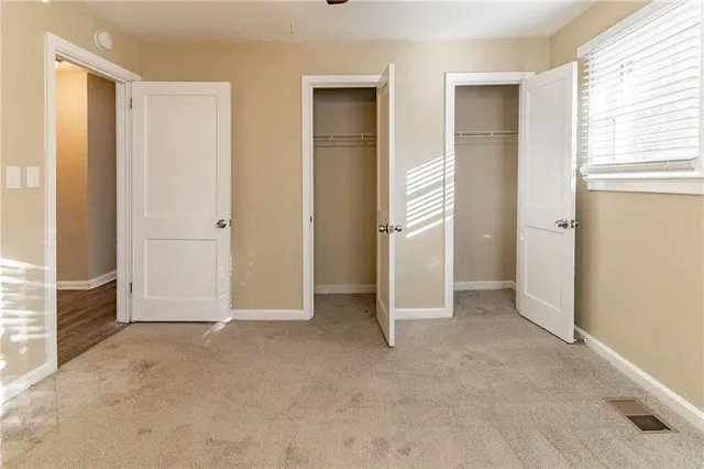 a view of an empty room with stairs