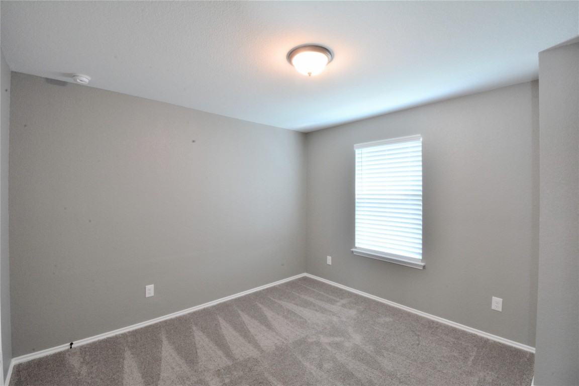 522 Thunder Valley Trail Georgetown, TX 78626 - Photo 13 of 24 a view of an empty room with a window