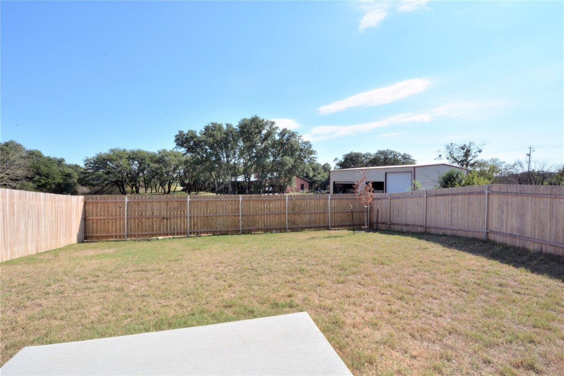 522 Thunder Valley Trail Georgetown, TX 78626 - Photo 24 of 24 a view of a backyard with wooden fence