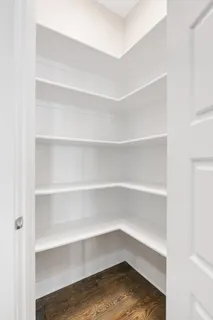a storage room with wooden floor