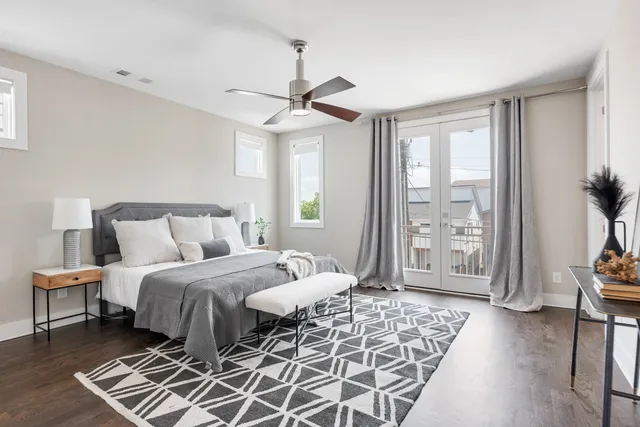 a bedroom with a large bed and a window