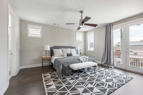 a bedroom with a large bed and a window