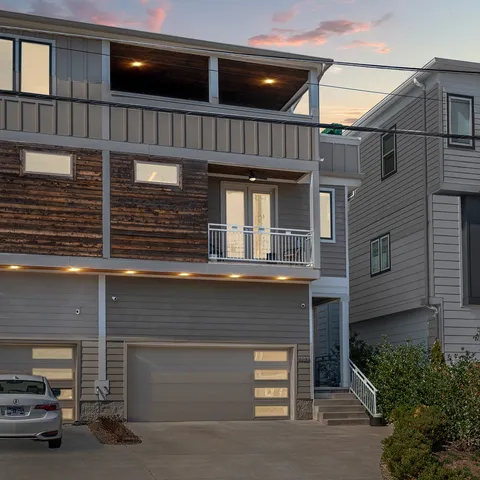 a front view of a house with garage