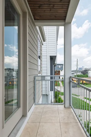 a view of a porch with a floor to ceiling window