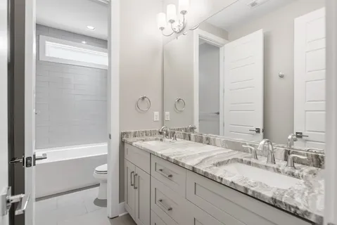 a bathroom with a sink a toilet and a bathtub