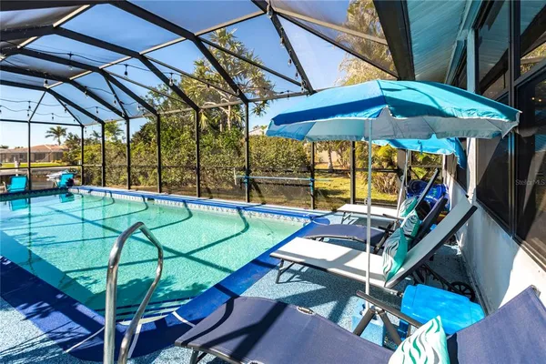 a view of a yard with swimming pool