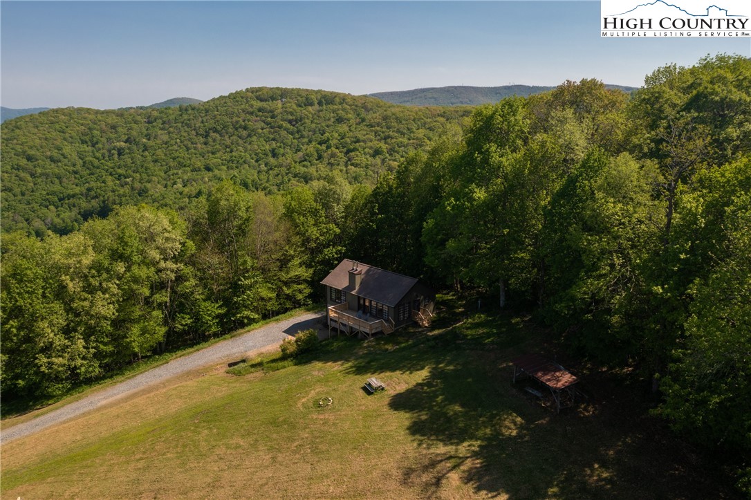 2520 Chestnut Grove Road Boone, NC 28607 - Photo 25 of 30 a view of a field with mountains in the background