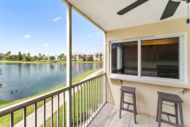 a view of a balcony with lake view and a ocean view