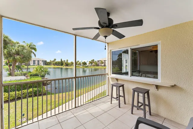 a view of a balcony with furniture